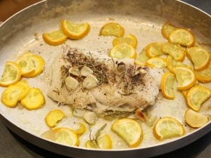 Merlu et courgettes jaunes au four